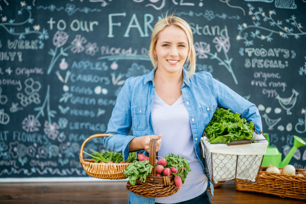 Woman with vegetable baskets - photo by FatCamera Getty Images Signature