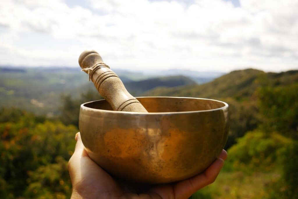 Tibetan singing bowl held out to you - Esaka RAKOTONDRAMANANA - Getty Images